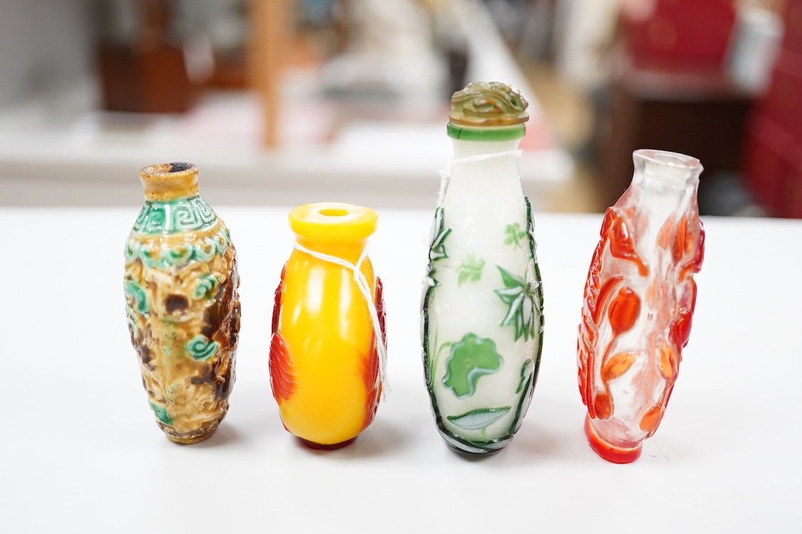 Three Chinese glass snuff bottles and a porcelain snuff bottle(4), tallest 8cm high